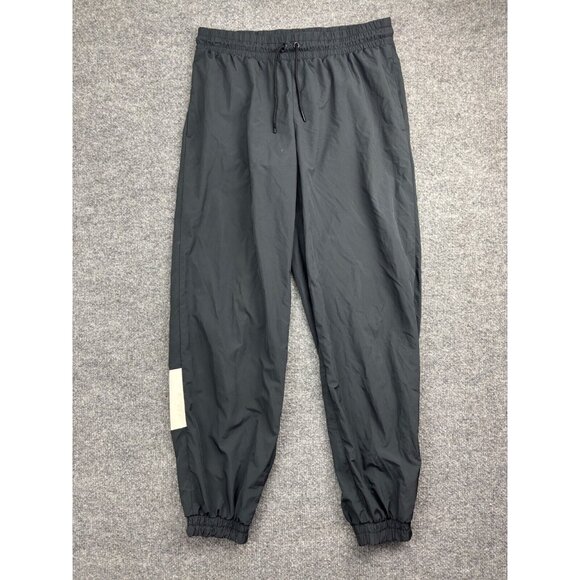 Nike Track Pants Men's Medium Black White Jogger Windbreaker Drawstring Pockets - Picture 1 of 11